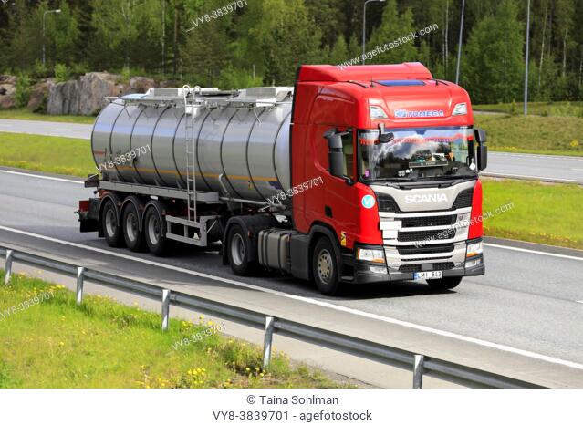 Red Scania R450 semi tanker truck Tomega hauls load on motorway in South of Finland. Salo, Finland. May 28, 2021