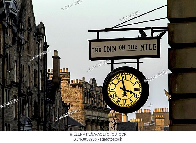 Sign with luminous clock in the real mile Edinburgh