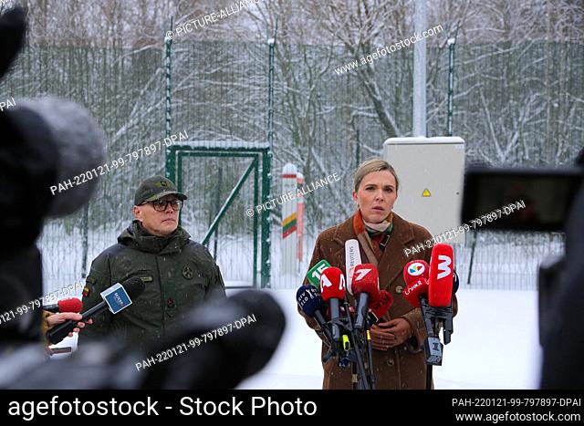 21 January 2022, Lithuania, Kurmelionys: Lithuania's Border Guard Chief Rustamas Liubajevas and Lithuanian Interior Minister Agne Bilotaite (r) speak with media...