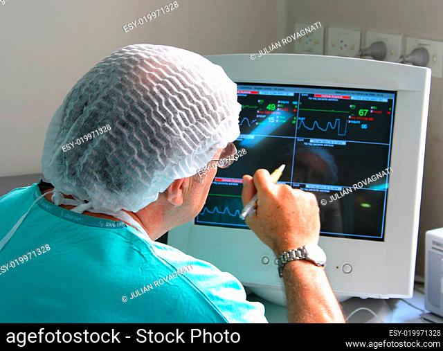 Doctor working with monitoring equipment