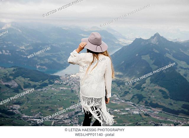 Rear view of woman on viewpoint, Grosser Mythen, Switzerland