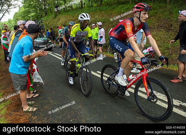 British rider Ben Turner of team Ineos and Eritrean rider Biniam Girmay of team Intermarche-Circus-Wanty cycle in the final ascent of Jaizkibel mount pass while...