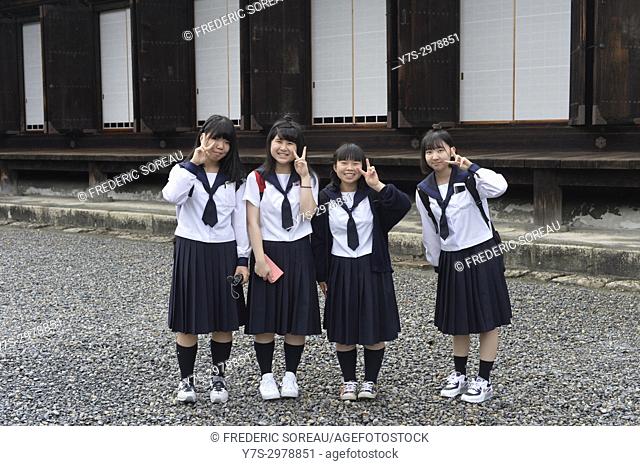Local schoolchildren in school uniform visiting Sanjusangen-do Buddhist temple complex, Higashiyama District, Kyoto, Japan, Asia