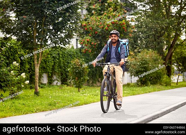 food delivery man with bag riding bicycle