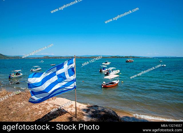 Greek flag by the sea