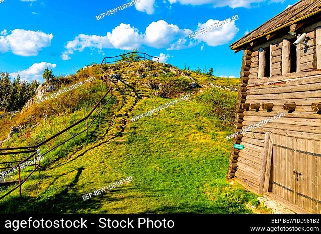 Podzamcze, Poland - August 25, 2020: Wooden fortifications and inner courtyard of Gora Birow Mountain stronghold near Ogrodzieniec Castle