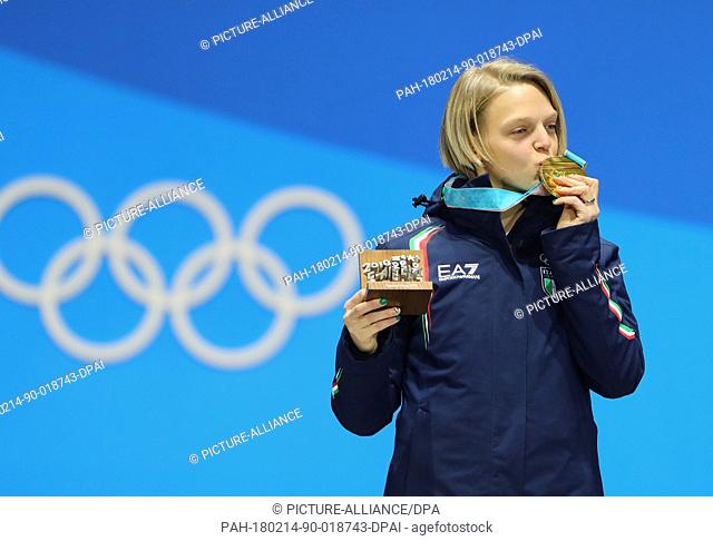 Arianna Fontana from Italy kissing her gold medal during the awards ceremony of the women's 500m speed skating event of the 2018 Winter Olympics in the...