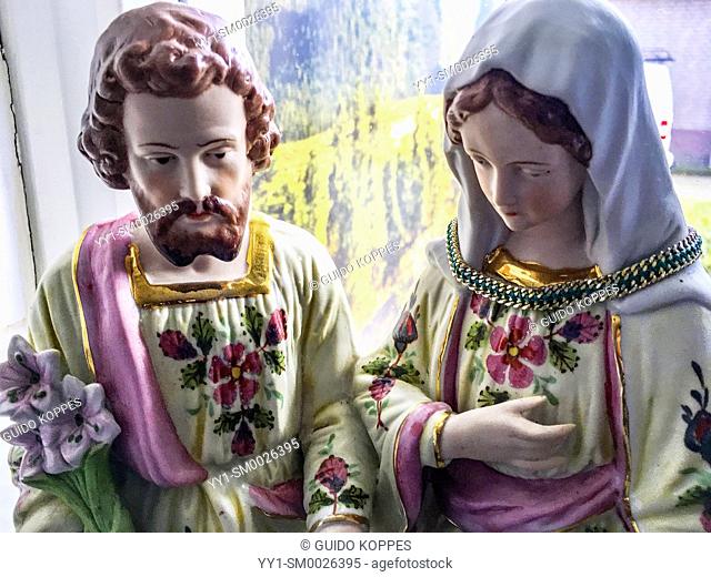 Dongen, Netherlands. Statue of Saint Joseph and Mother Maria near the kitchen window inside a religious household