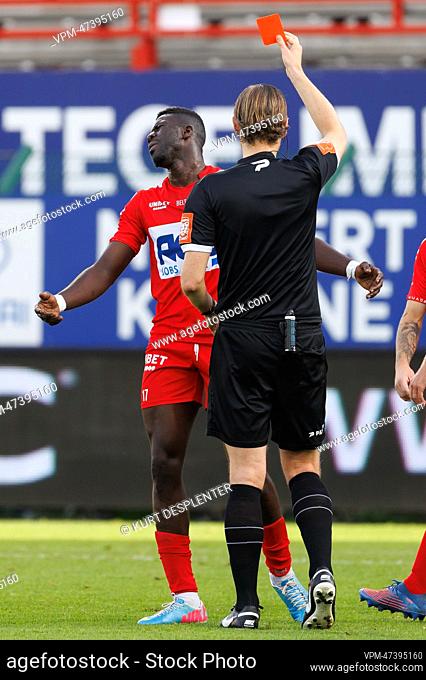 Kortrijk's Pape Habib Gueye receives a red card from the referee during a soccer match between KV Kortrijk and KVC Westerlo
