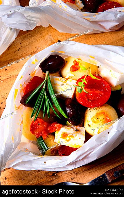 baked small dumplings with zucchini tomatoes and diced sheep's cheese