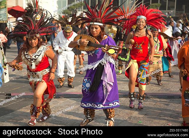 Indigenous dancers in traditional costumes perform at the pilgrimage to Our Lady of Guadalupe Basilica during the Virgen de Guadalupe Festival in Mexico City