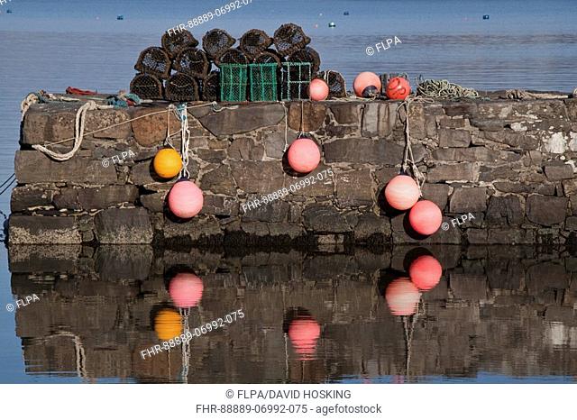 Lobster pots and floats on the pier in Craighouse Isle of Jura, Scotland