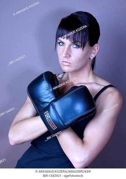 Woman, athlete, boxer, looking serious, standing