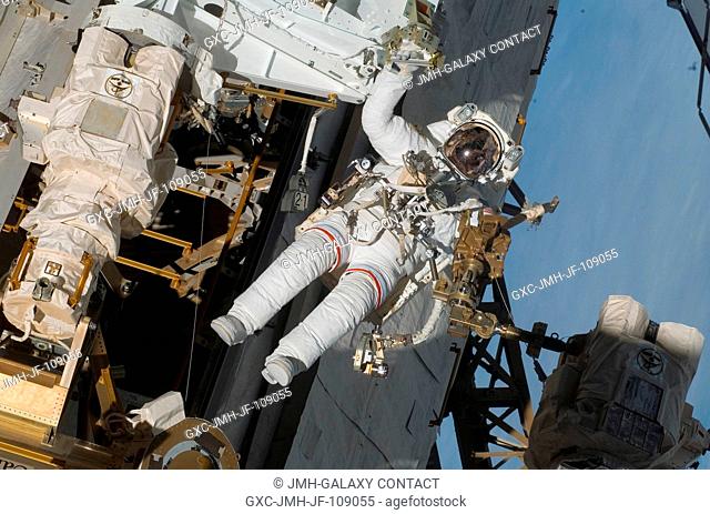 Astronaut Rick Linnehan, STS-123 mission specialist, participates in the mission's third scheduled session of extravehicular activity (EVA) as construction and...
