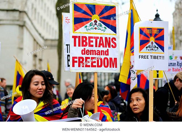 Tibetans and supporters of Tibet take part in a demonstration outside Downing Street in Whitehall, London, and march to the Chinese Embassy in London to mark...