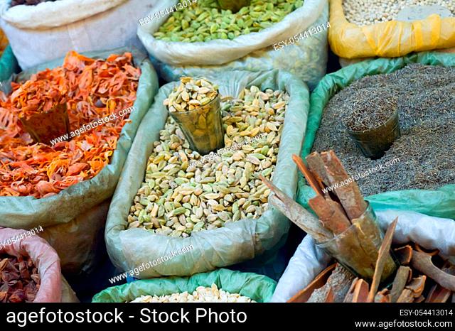 Various colorful essential Indian Himalayas traditional spices, herbs and seasonings in Burlap Sack for display. These contributes five basic tastes sweet sour...