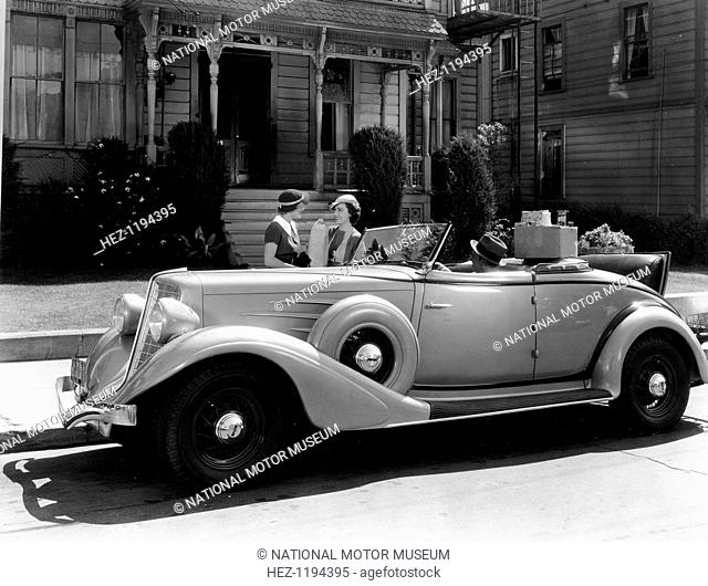 Auburn 8 Convertible Coupe, 1934. In a scene from the Columbia Motion Picture White Lies (1934), Robert Allen sits in the car while Fay Wray and Irene Hervey...