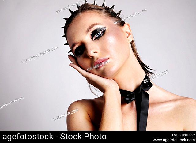 Portrait of caucasian young woman with creative make-up. High quality photo