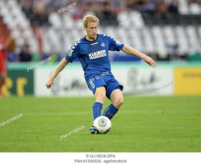 Karlsruhe's Philipp Klingmann plays the ball during the first round DFB Cup match between Karlsruher SC and VfL Wolfsburg at Wildpark stadium in Karlsruhe