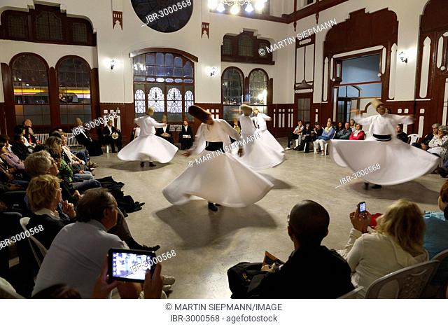 Whirling Dervishes dancing the Sema, a Dervish dance, Sirkeci Railway Station, Istanbul, Turkey, Europe