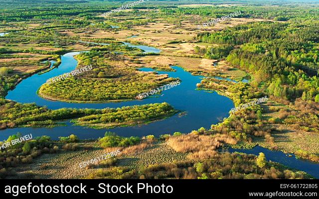 4K Aerial View Green Meadow And Forest On Coast Of Curved River Landscape In Sunny Summer Day. Top View Of Beautiful European Nature From Attitude