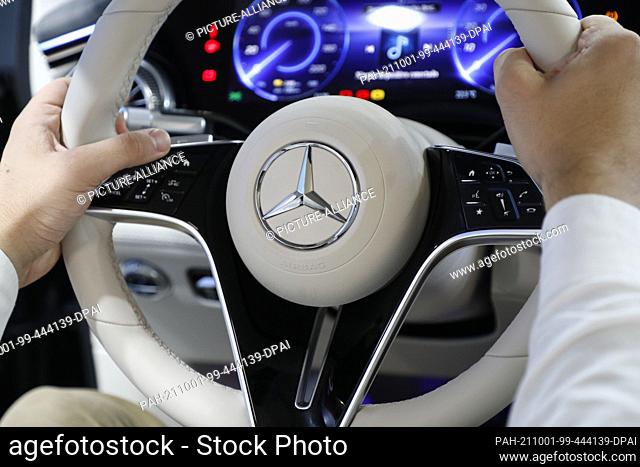 01 October 2021, Spain, Barcelona: The steering wheel of a Mercedes EQ on the Mercedes-Benz stand at ""Automobile Barcelona 2021""