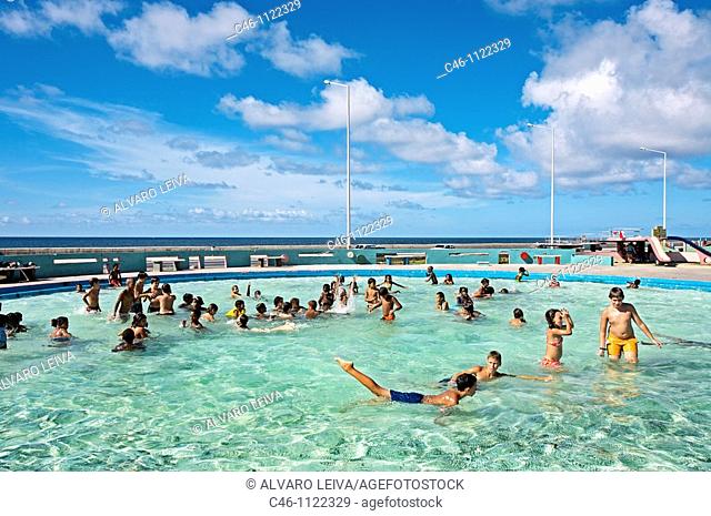 Swimming pool by the malecon sea front boulevard. La Havana. Cuba
