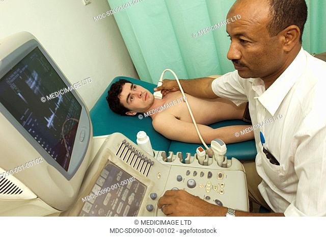 A technician uses ultrasound to examine the carotid artery of a patient for any abnormalities such as stenosis narrowing