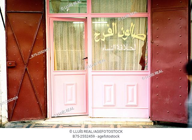 Door of a hairdressing business in Fez Medina, Morocco, Africa