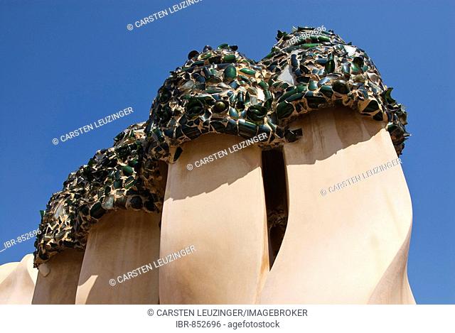Chimneys on the roof of Casa Milà designed by the architect Antoni Gaudí, also known as La Pedrera, the Quarry, at the Passeig de Gràcia, Eixample district