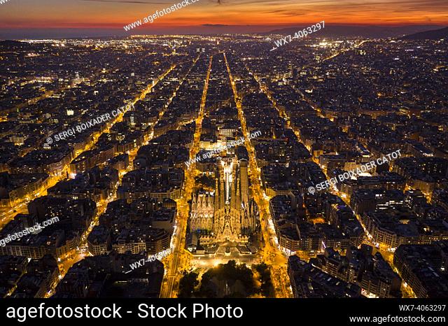Nativity Facade of the Sagrada Família and Eixample in Barcelona in the evening twilight. Aerial views (Catalonia, Spain)