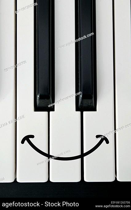 Abstract Shot Of Piano Keyboard and Draw Happy Smile