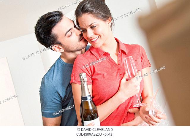 Young couple celebrating with champagne