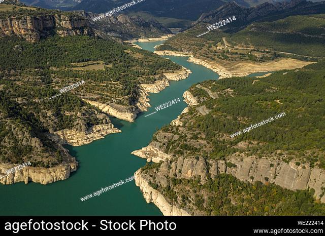 Aerial view of La Llosa del Cavall reservoir with little water during the summer drought of 2022 (Vall de Lord, Lleida, Catalonia, Spain)