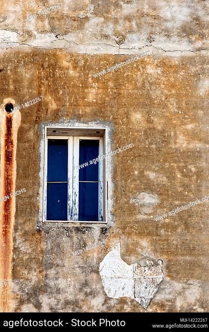 Single window in a Mediterranean house wall
