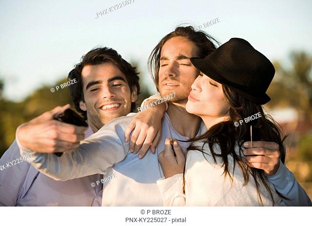 Three friends taking a picture of themselves