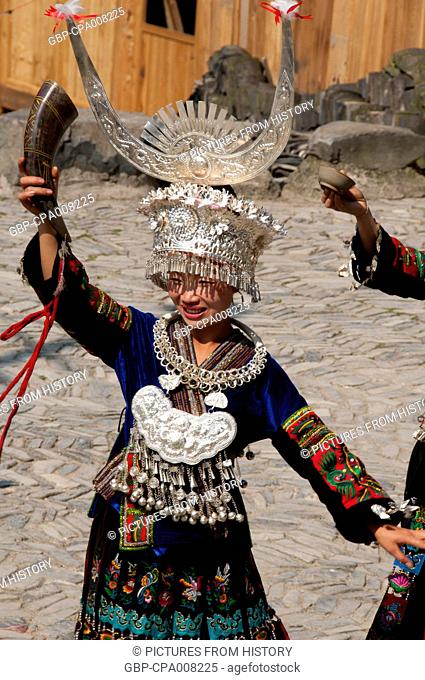 China: Miao woman dancing in the village of Langde Shang, southeast of Kaili, Guizhou Province