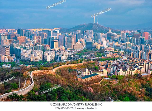 Aerial view of Seoul downtown cityscape and Namsan Seoul Tower on sunset from Inwang mountain. Seoul, South Korea