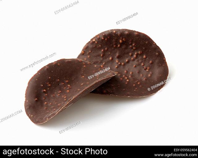 Cripsy dark chocolate wave chips isolated on white