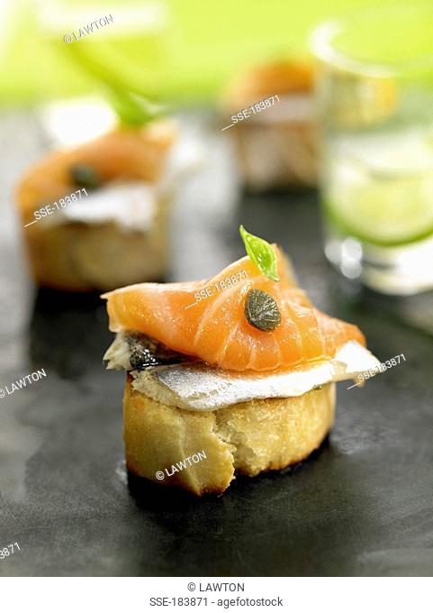 Anchovy, smoked salmon and caper crostini