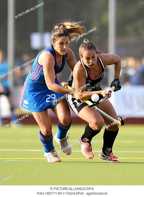 11 July 2018, Germany, Munich: Hockey, Womens: Four Nations Cup, Germany vs Argentina, 1st matchday: Lisa Altenburg (R) of Germany and Julia Gomes of Argentina...