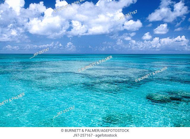 View from Grand Turk Island shore looking westerly across the varied hues of turquoise blue ocean. Turks and Caicos Islands, Caribbean