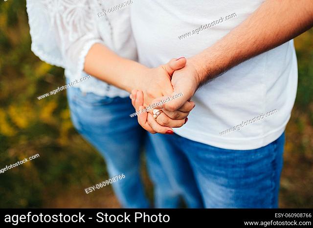 Lovely couple outdoor has romantic photo session. High quality photo