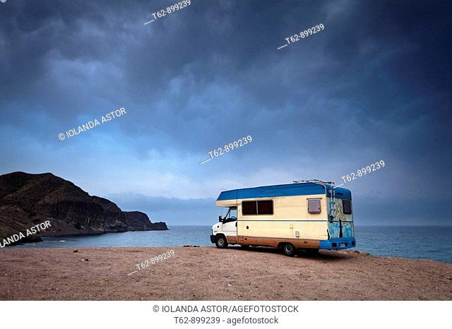 Vehicle caravan parked next to the cliff  Costa del Cabo de Gata  Isleta del Moro, Almería, Andalusia, Spain