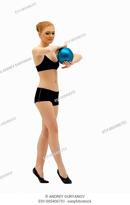 Young gymnast dance with ball in black