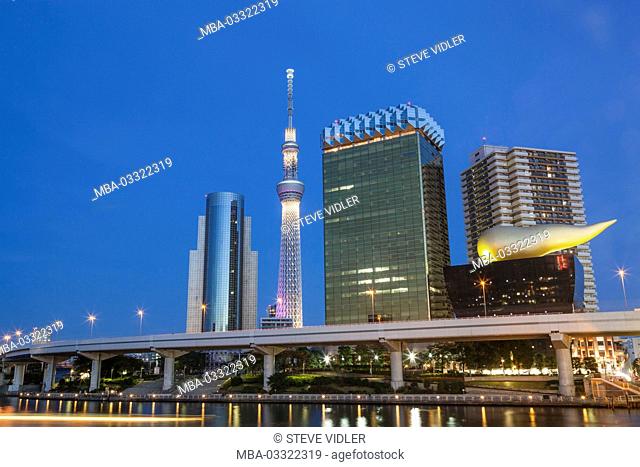 Japan, Honshu, Tokyo, Asakusa, office building and Skytree Tower in the Sumidagawa River