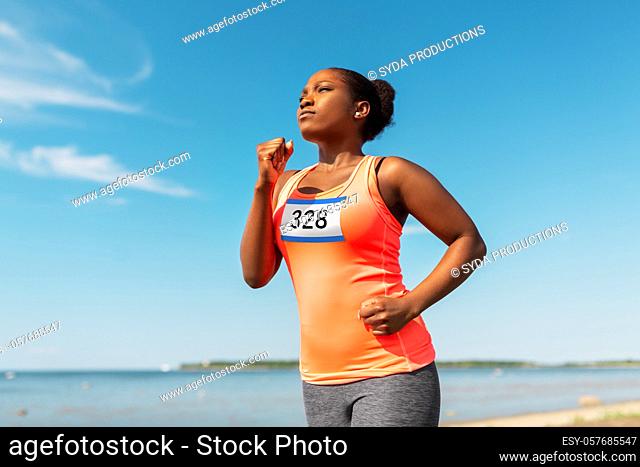 young african american woman running marathon