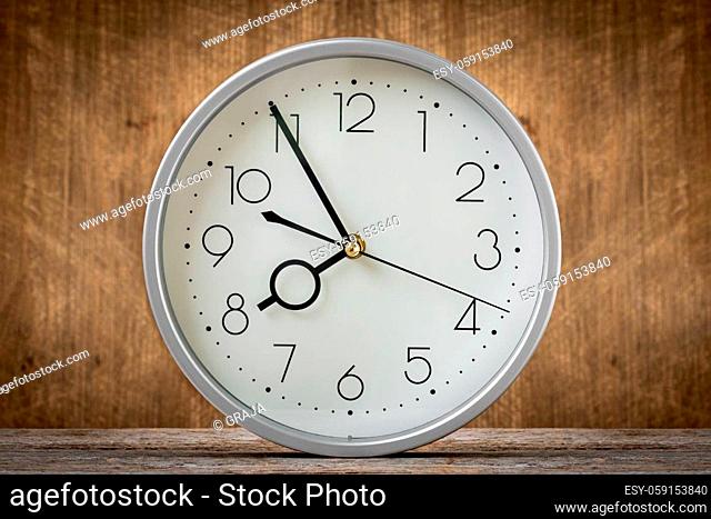 Clock showing 7:55 o'clock in a morning