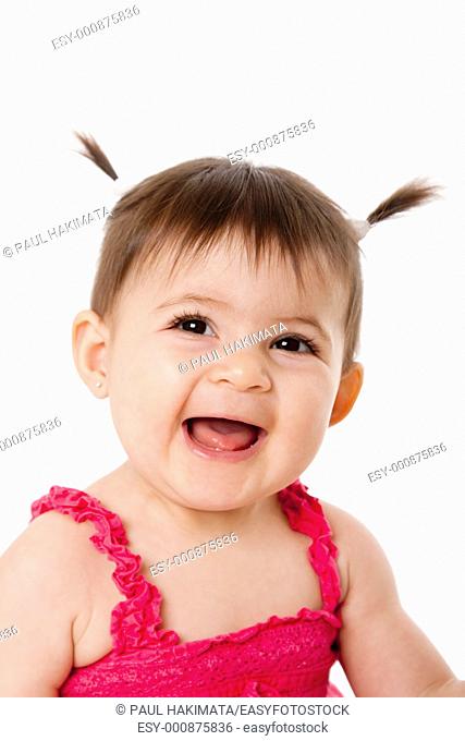 Face of cute happy smiling laughing baby infant girl with ponytails, isolated