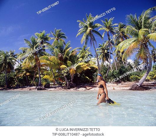 French Polynesia, Bora Bora, local girl going snorkeling